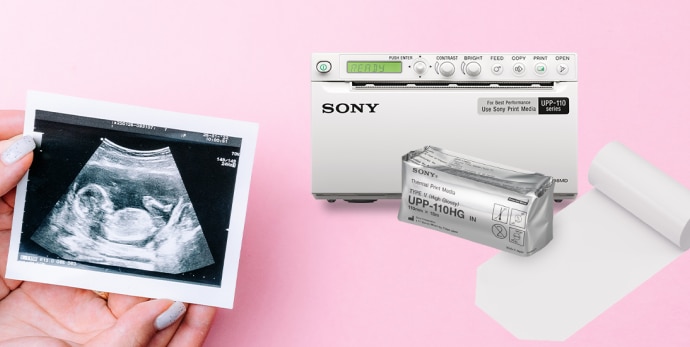 Sony thermal black and white printer with the thermal print media UPP-110HG and the ultrasound image of the baby on pinky background