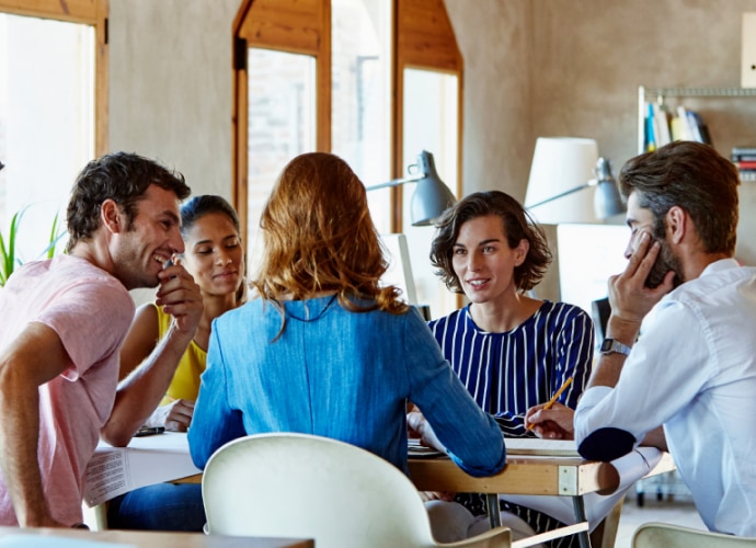 5 people in small office setting