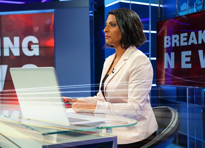 Newsroom presenter in studio