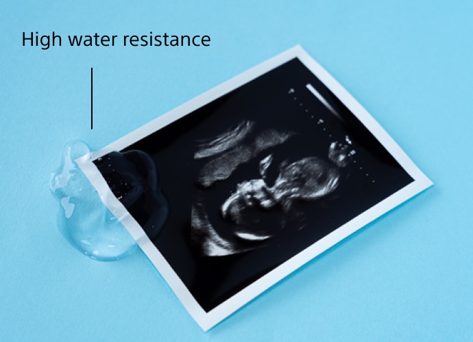 An ultrasound image with water drops on blue background