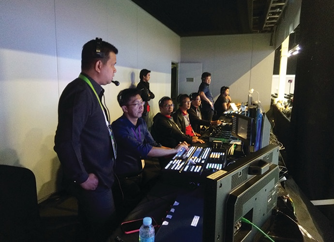 image of delegates in a studio control room