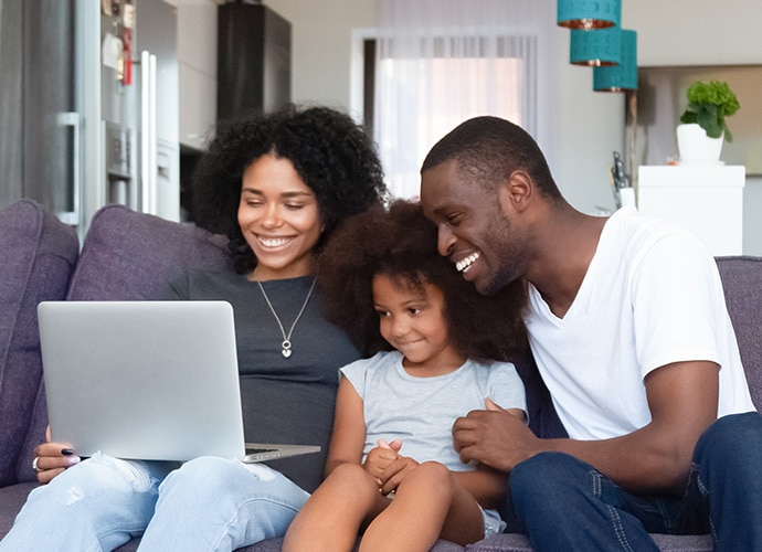 A family with a laptop computer