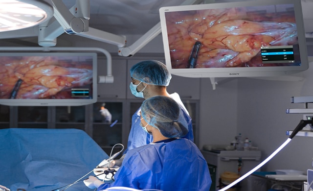 Two Surgeons are looking at the surgical images displayed on Sony’s surgical monitors