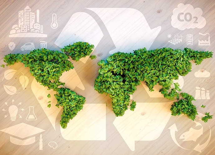 Green leaves forming the world map with a recycling arrow icon as the background