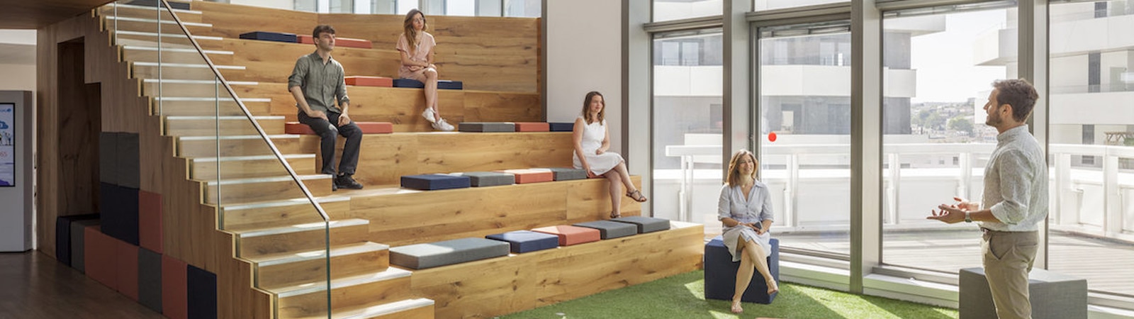 Large banner image showing the interior of the trendy, modern and sleek Capgemini workplace.