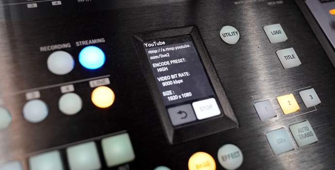 Close-up of the MCX-500 with illuminated buttons and LCD touchscreen control