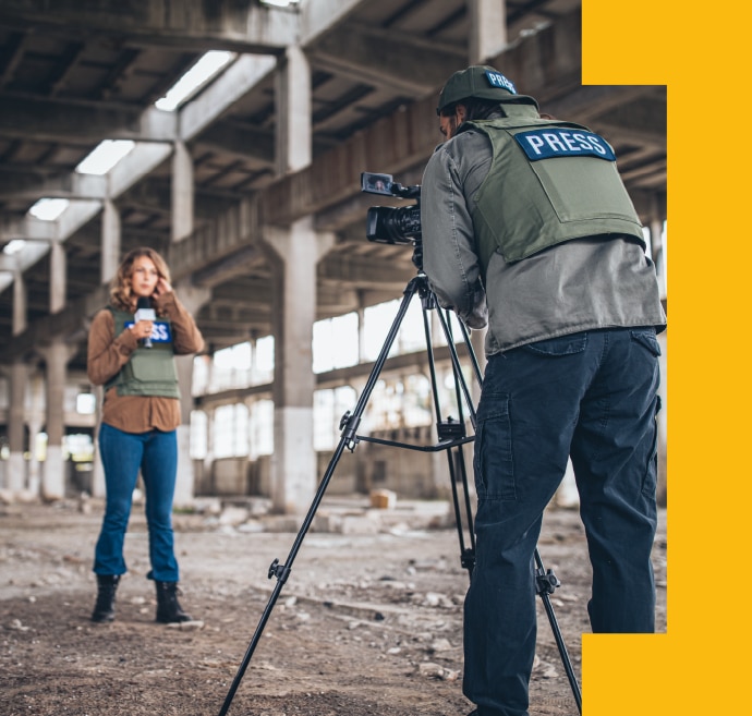 Journalist on the field broadcasting live