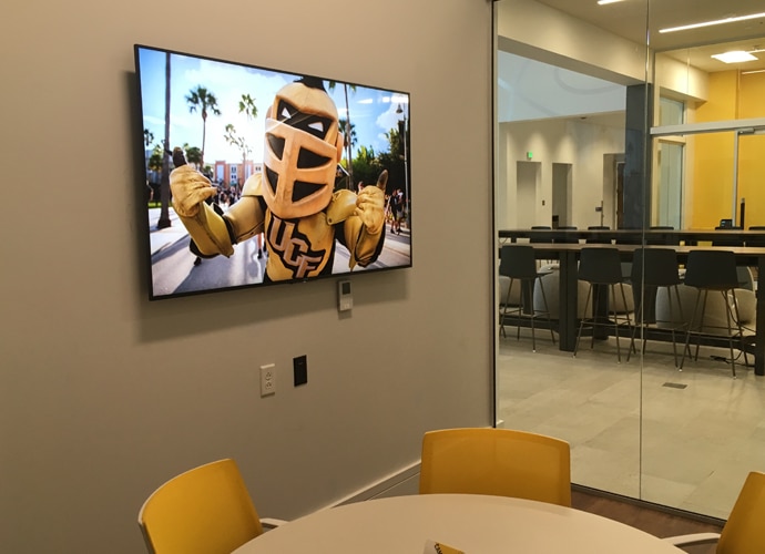 Image showing a UCF-themed image on a BRAVIA screen.