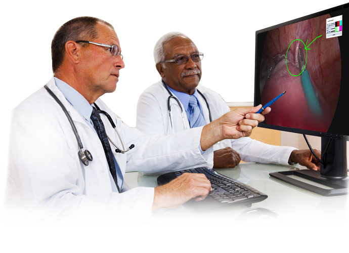 Two doctors looking at an annotated surgical image streamed to a desktop monitor via the NUCleUS platform