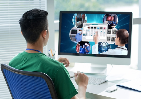 Surgeon looks at screen displaying Sony healthcare webinar