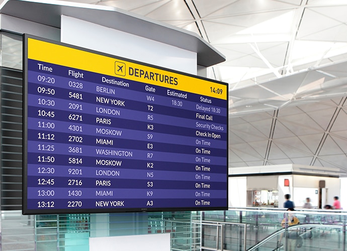 Image of a Sony screen in an airport showing flight arrivals.