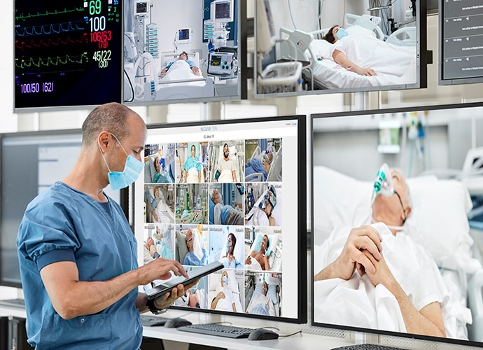 Surgeon checks multiple ICU patients in Sony display