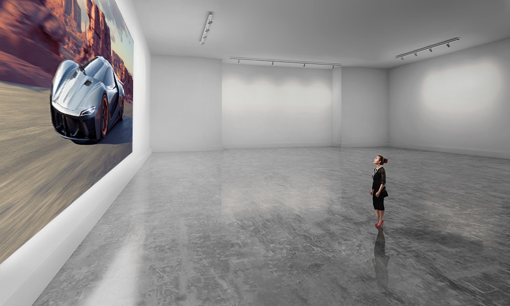 A customer in a room looking at a Crystal LED wall with a car