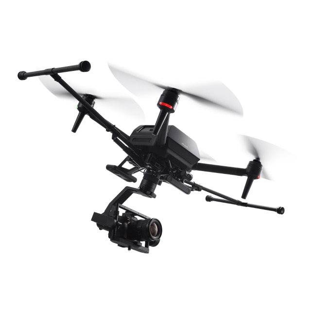 Drone flying in the air with a camera attached