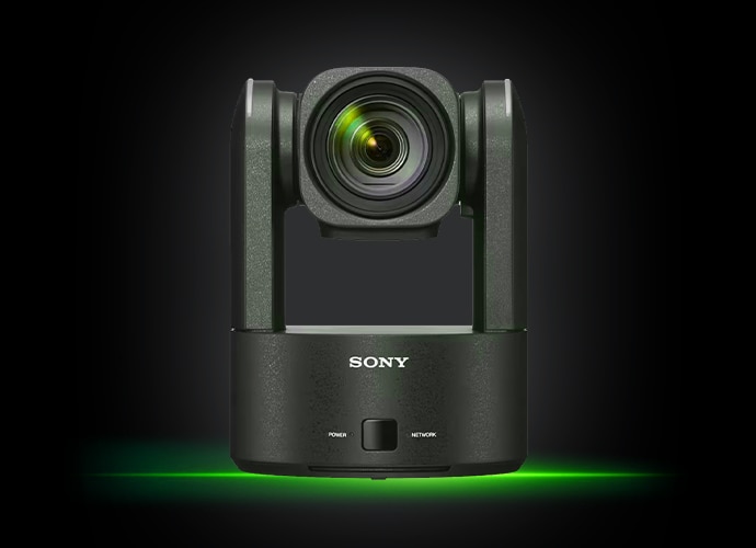Sony´s BRC-AM7 PTZ Camera on a dark background with a subtle green light effect at the base