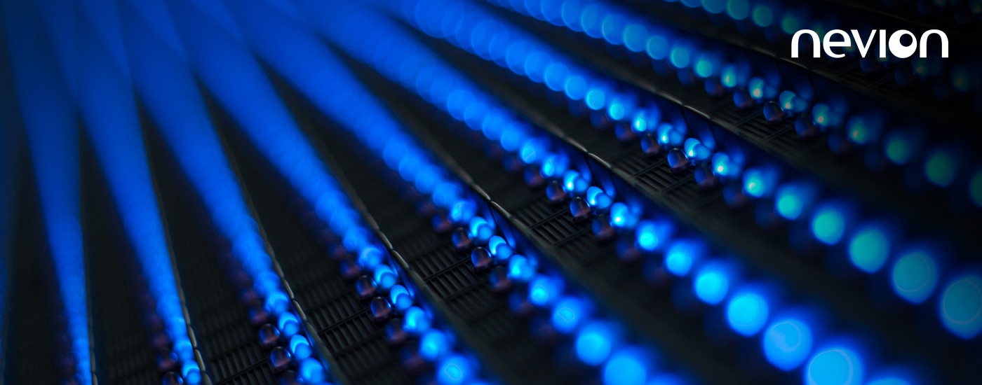 Small spheres in a row, lit up in blue