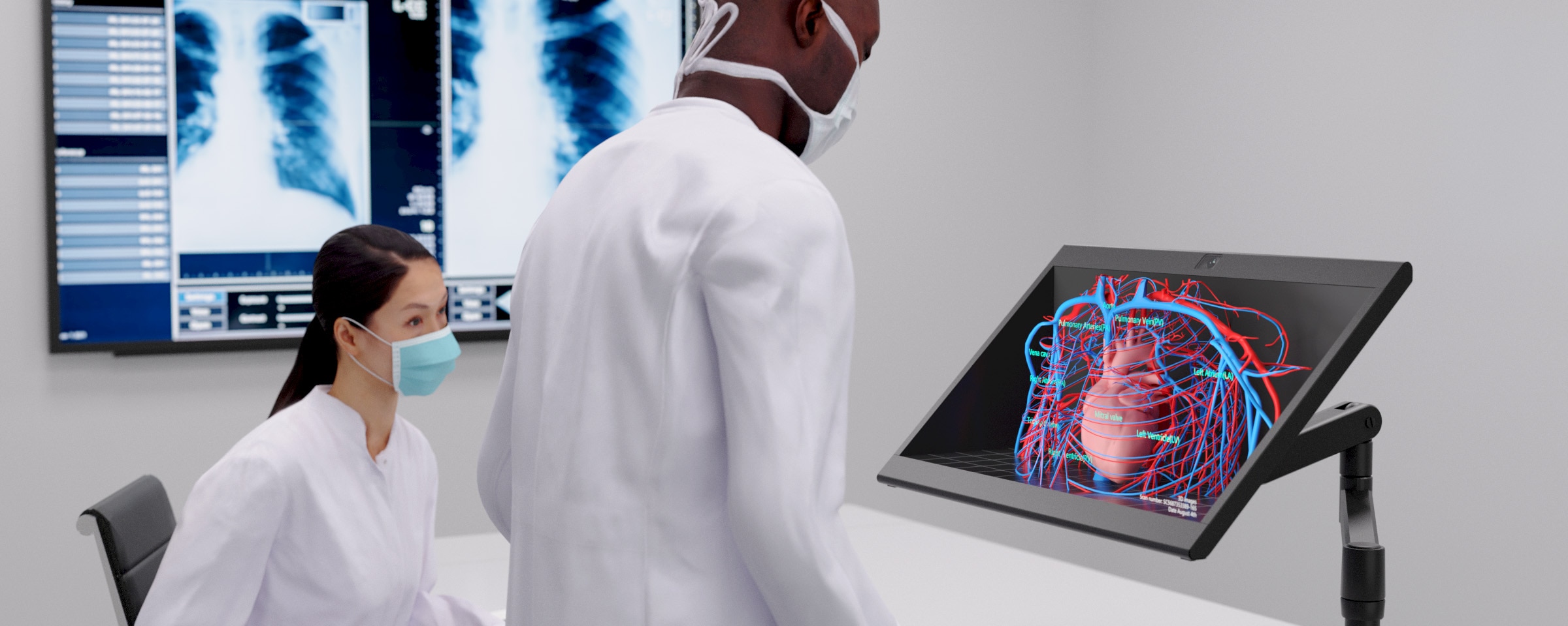 Image of SR2 screen being used in medical environment with medics and x-ray displayed on screen.