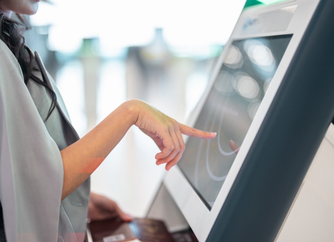 Woman touching check-out display