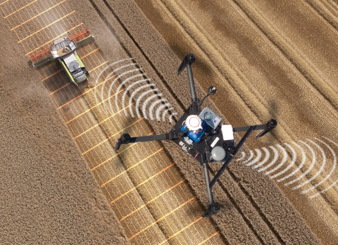 A drone flying above an agriculture field