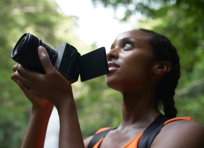 A woman holding a camera.