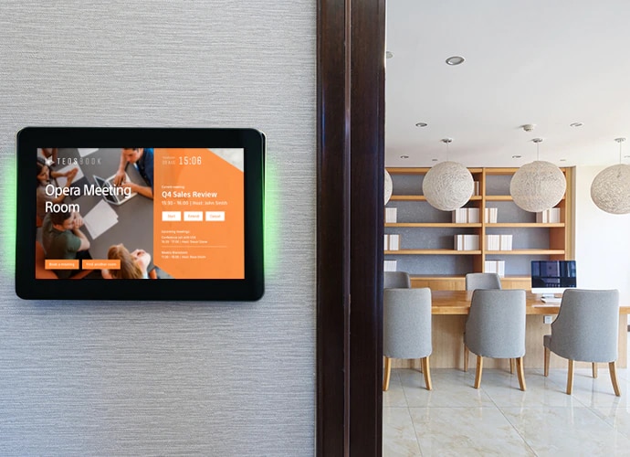 image of tablet on meeting room external wall with teos room booking tool