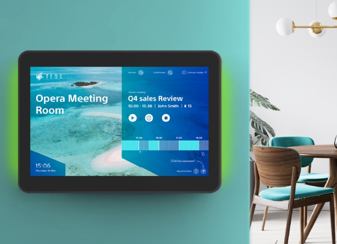 image of tablet on meeting room external wall with teos room booking tool