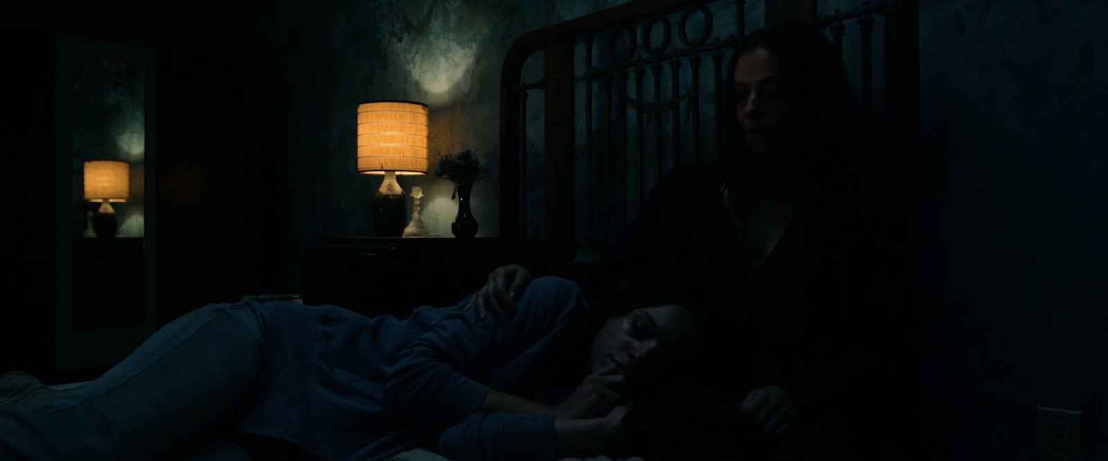 Ambar’s bedroom is lit by a small bedside lamp in "No One Gets Out Alive"