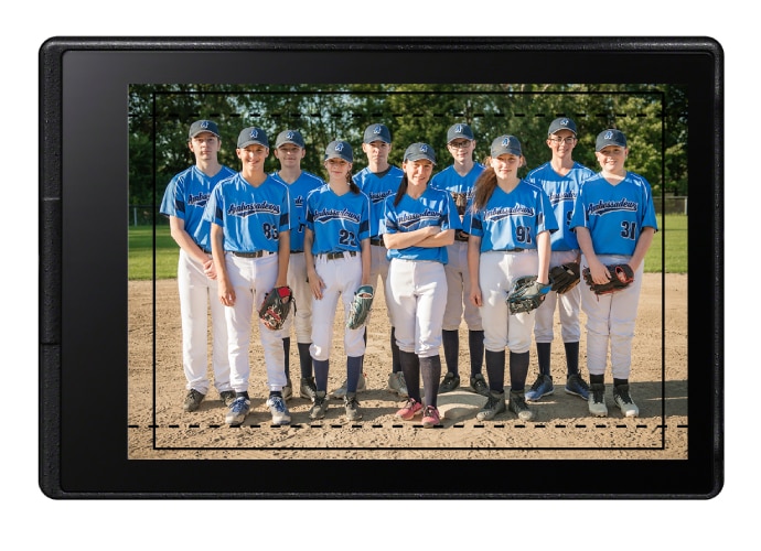 Photo of a young girls’ sports baseball team