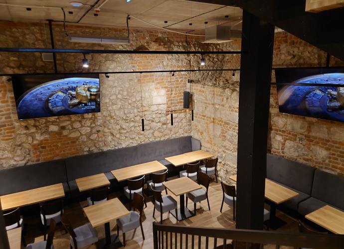 View of restaurant with 2 BRAVIA Screens displaying information