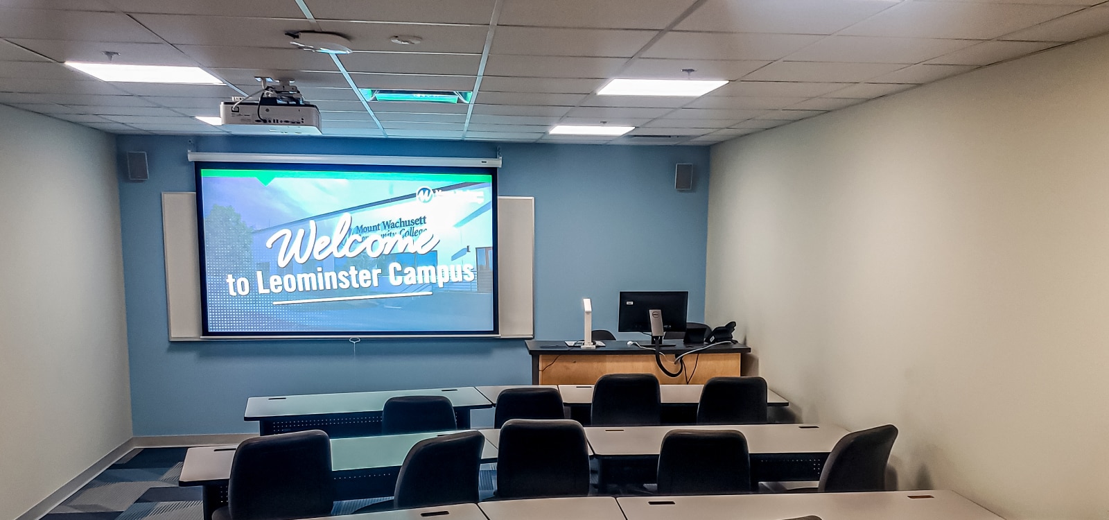 Lecture room with large screen and Sony projector