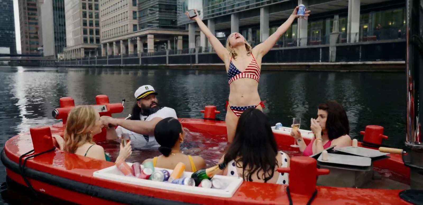 Kirsten Bell in bikini on boat in scene from The People We Hate at the Wedding