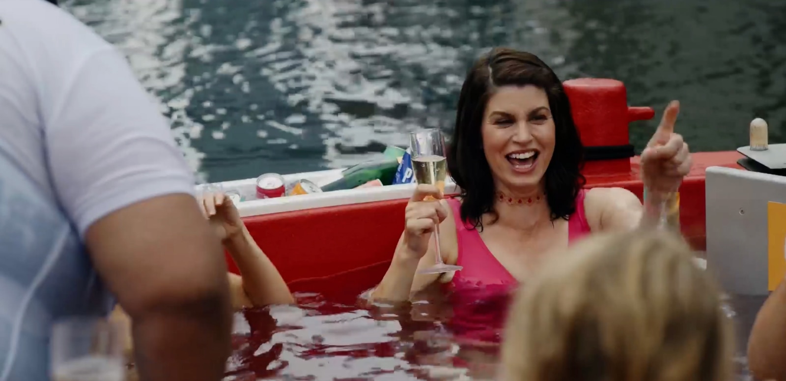 Jemima Rooper with champagne glass in boat scene from The People We Hate at the Wedding