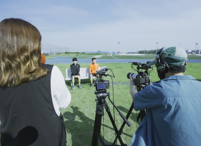 A group of people filming an interview