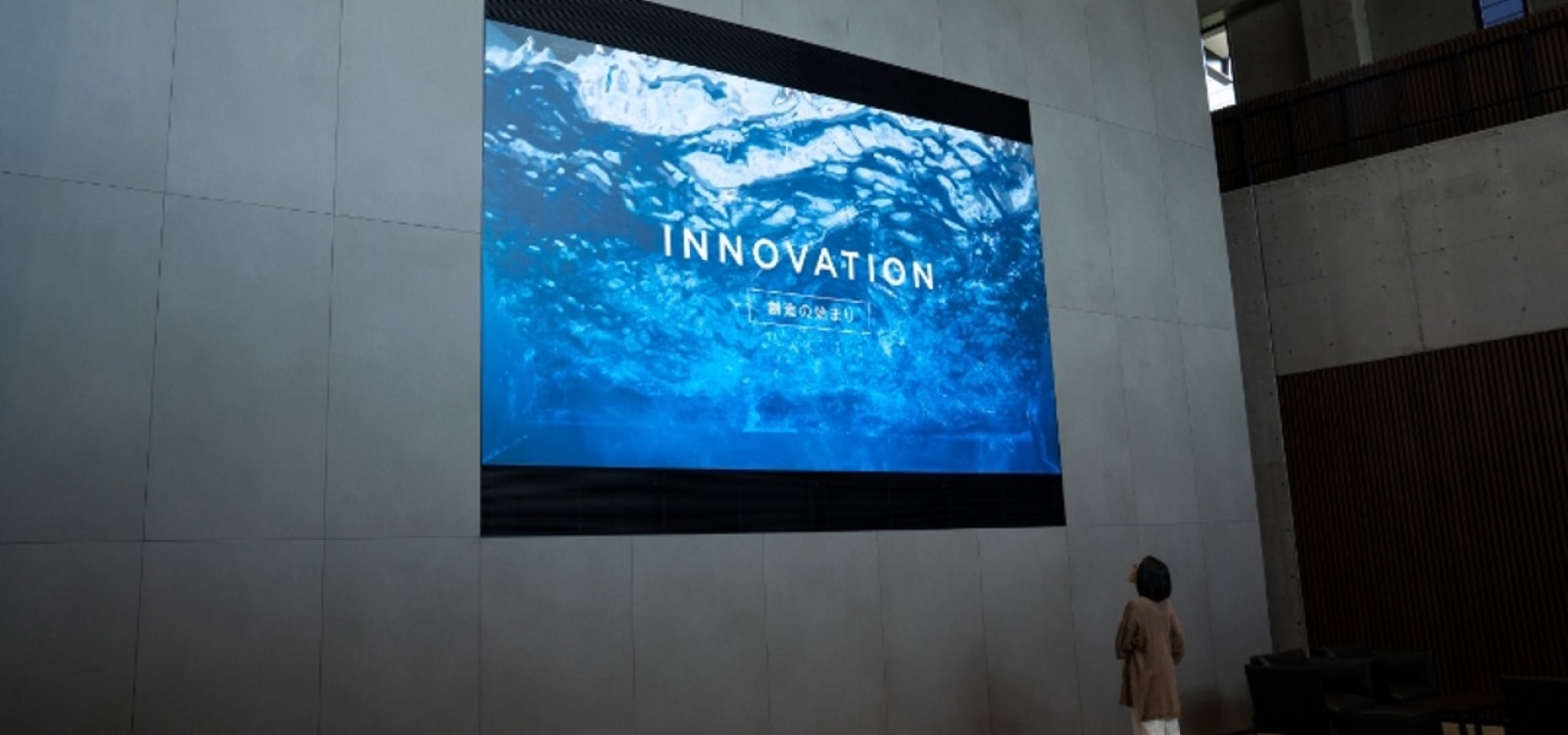 CLED screen in entrance with image and “innovation” text on it