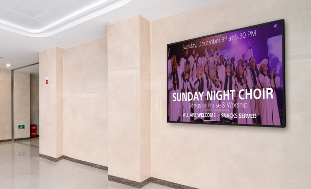 Wall-mounted BRAVIA display with faith-based messaging.