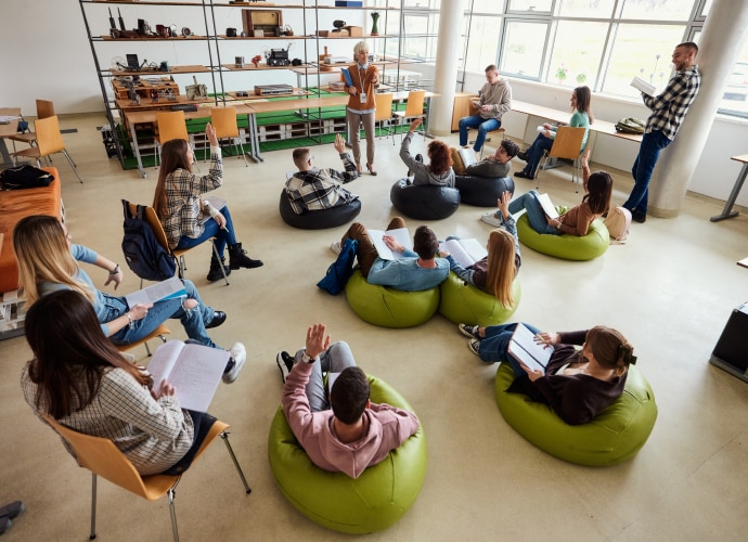 Students sitting with notepads in a lecture room