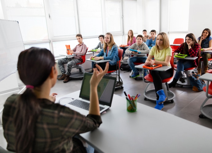 Students and a teacher in a classroom