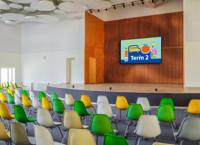 A lecture room with a BRAVIA Display on the wall