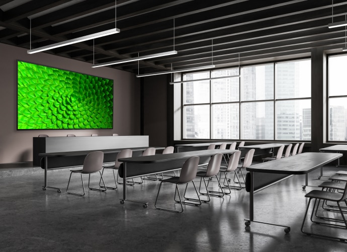 A lecture room with a BRAVIA Display on the wall