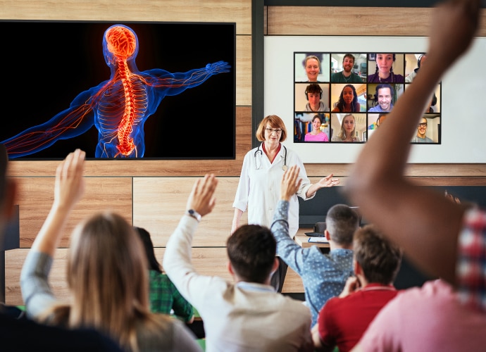 Lecture room with in-person and online students on the BRAVIA display