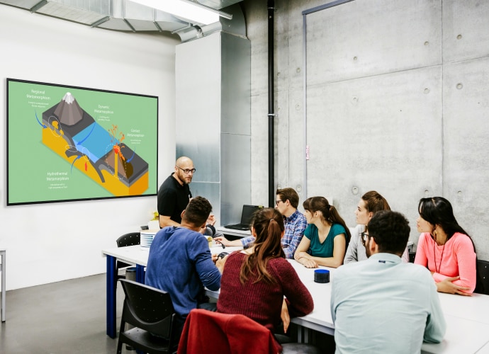 A teacher using a BRAVIA display in his class