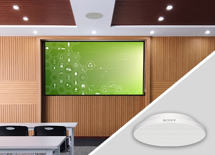 A classroom with a BRAVIA display and beamforming microphone on the ceiling