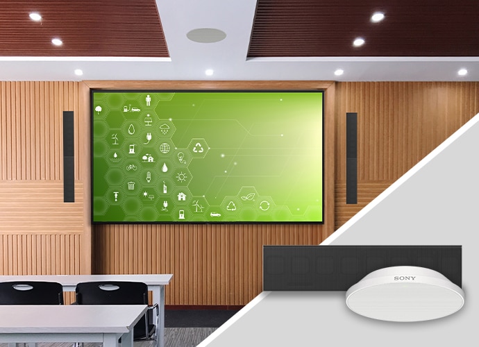 A classroom with Bravia display and line-array speaker system on the wall and beamforming microphone on the ceiling