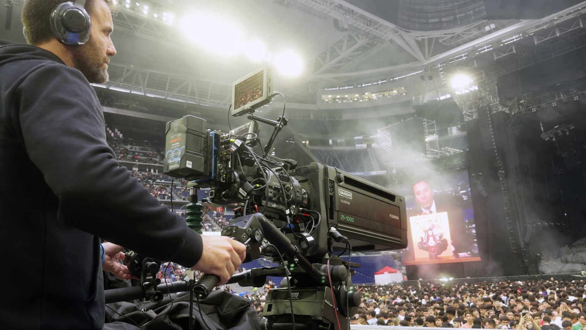 A cameramen shooting at an event