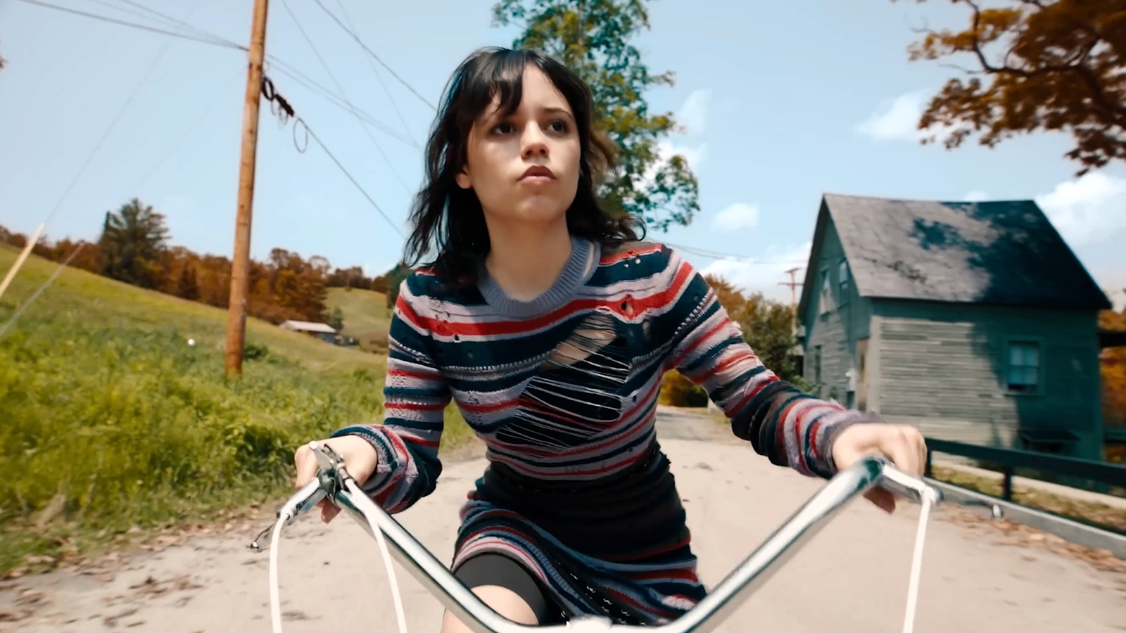 Jenna Ortega on bike in Beetlejuice Beetlejuice