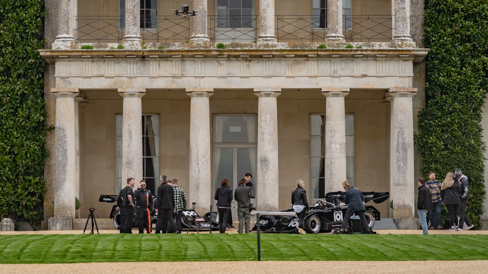 CanAm Shadow racing cars and production crew outside Goodwood House