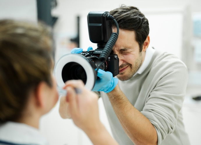 Dentist is using Sony’s large-format sensor camera to take the image of the patient’s teeth