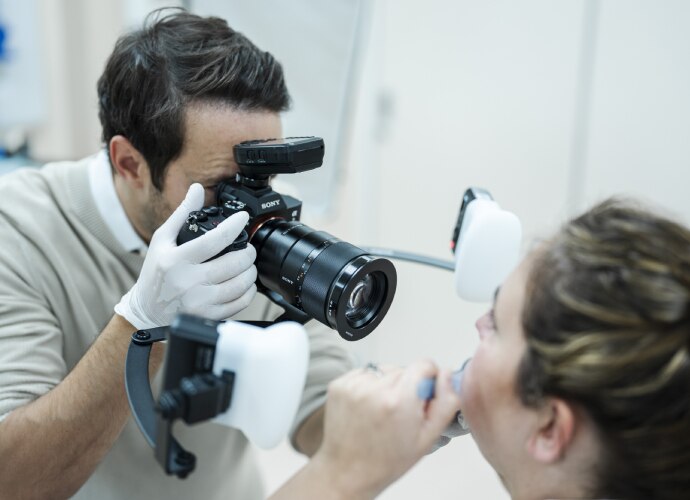 A dentist is taking an image of patient’s teeth