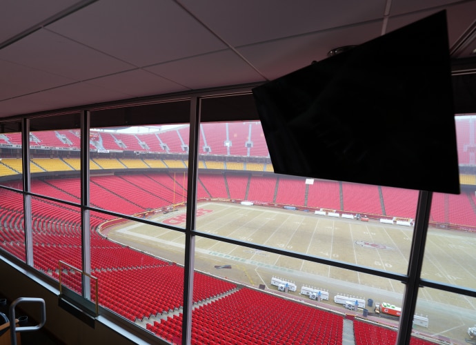 One BRAVIA display mounted in a box or suite overlooking the empty Kansas Chiefs football stadium